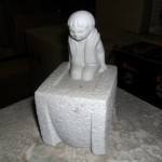 Stenen beeldje in bad